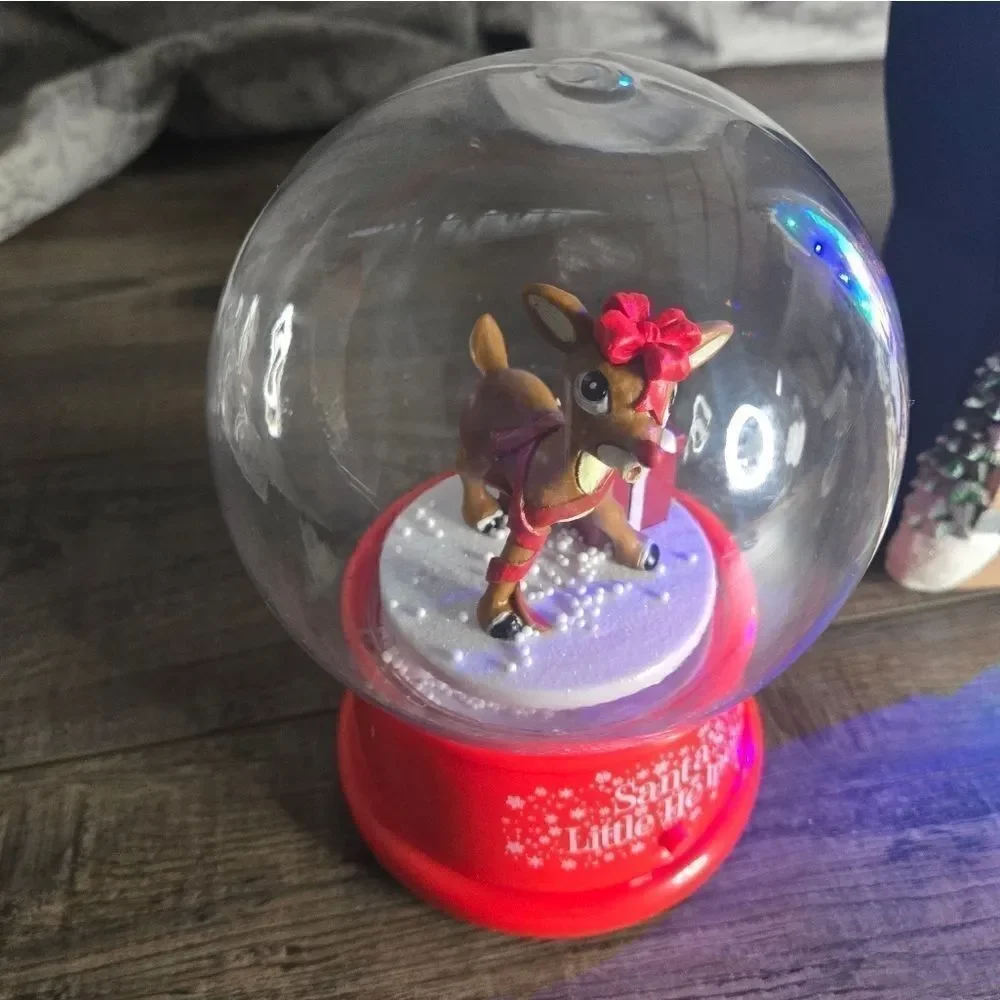 Two snow globes, animated snow, one is musical  and lights up htf